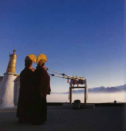 
Monks at dawn on the roof of Nechung Monastery - Illustrated Teachings of the Dalai Lama book
